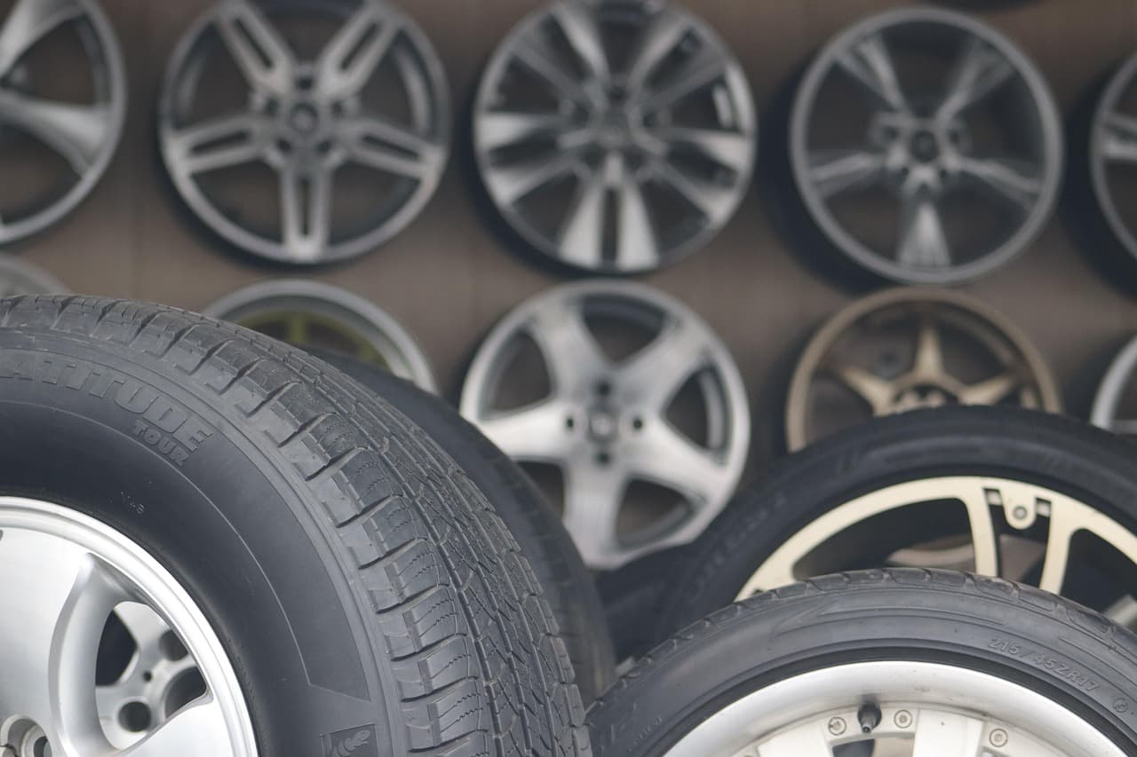 Tyres and alloy wheels stacked in a tyre bay