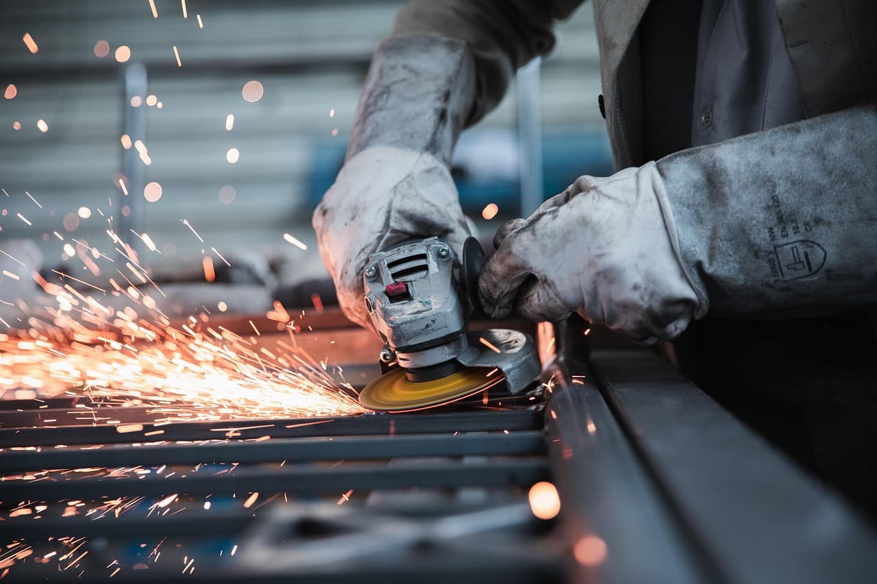 Sparks flying from an angle grinder in a workshop